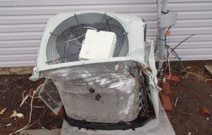 Windblown debris could clog the condenser coils or cause major damages, such as this crushed condensing unit.